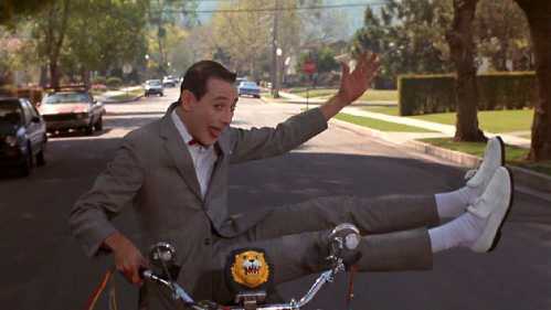 Pee Wee Herman doing bike tricks immediately before crashing in Pee Wee's Big Adventure