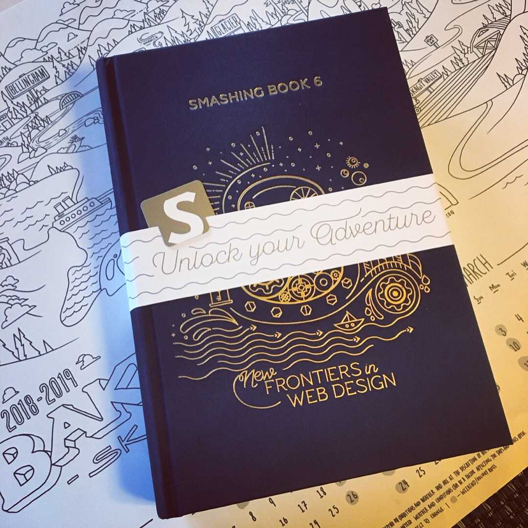 Gorgeous embossed hardcover of Smashing Book 6 on top of an illustrated map