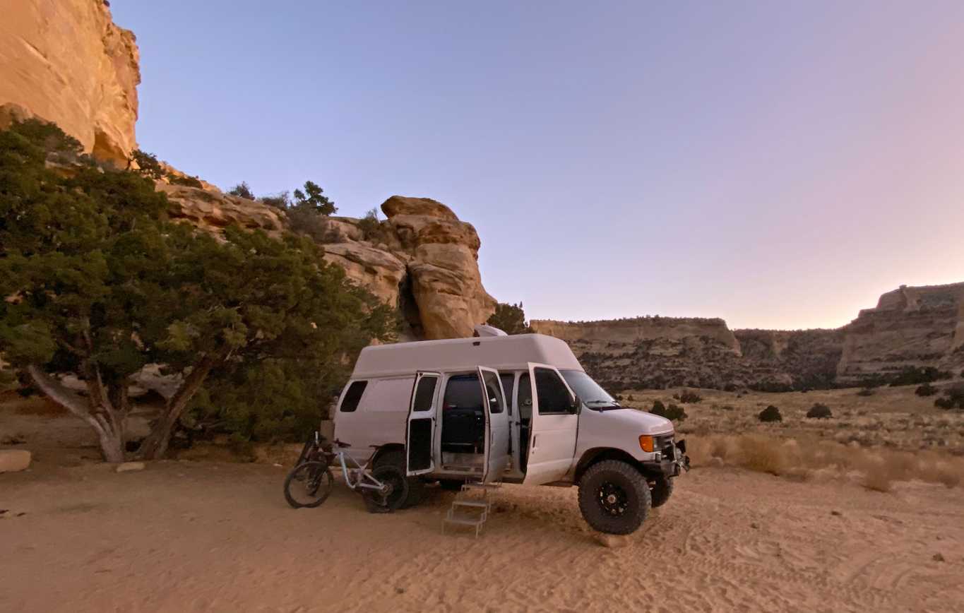 Our van parked at Slipper Arch with the doors open and my mountain bike leaning against it